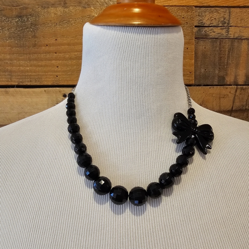 Black beaded necklace with bow detail